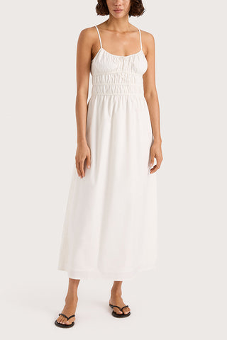 White midi length dress with adjustable spaghetti straps from Faithfull the Brand. 