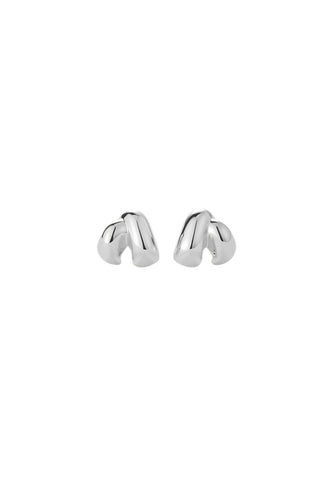 Jenny Bird Beatrix Earrings in high-polish sterling silver, featuring a unique sculptural ribbed design and a comfortable huggie-style fit. These modern silver hoops offer a bold, architectural statement that elevates everyday basics or adds a sophisticated touch to evening attire.