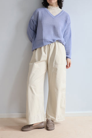 RUS Matsu Sweater in Salvia Blue, a boxy V-neck mesh sweater crafted from a premium corded organic cotton blend with a unique dry handfeel. This lightweight, breathable designer pullover features a relaxed silhouette and deep ribbed detailing, making it an effortless layering piece for modern, elevated everyday style.