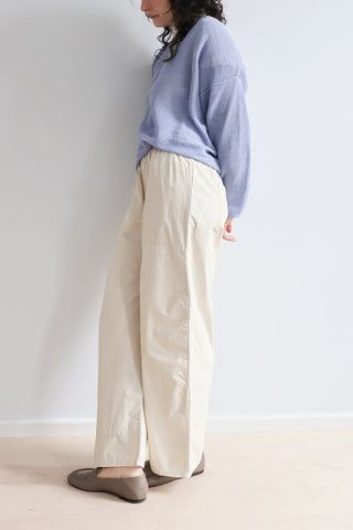 RUS Matsu Sweater in Salvia Blue, a boxy V-neck mesh sweater crafted from a premium corded organic cotton blend with a unique dry handfeel. This lightweight, breathable designer pullover features a relaxed silhouette and deep ribbed detailing, making it an effortless layering piece for modern, elevated everyday style.