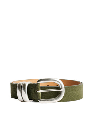 By Malene Birger Zoira Suede Belt in Deep Lichen Green, featuring a wide suede strap and a signature curved silver buckle. This adjustable one-size belt is designed to cinch the waist or sit on the hips for a sophisticated, textured look.