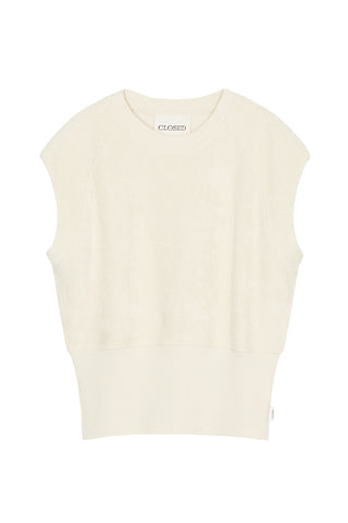 The Closed Sleeveless Crew in Beige is a premium knit top featuring a structured sleeveless design and a wide ribbed hem for a sophisticated, tapered fit. This versatile neutral vest is crafted from high-quality materials, making it an essential layering piece for contemporary minimalist wardrobes.