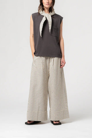 Girls of Dust Culotte Pant in Iron/Off White, featuring a bold vertical stripe pattern and a relaxed, wide-leg cropped silhouette. These high-waisted designer trousers are crafted from durable cotton for a comfortable, utilitarian look.