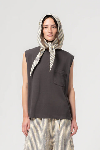 Girls of Dust Jackie Scarf in Iron/Off White, a versatile striped accessory made from durable Fuji nylon with a unique tie-front design. This lightweight designer headscarf or neck wrap adds a modern, utilitarian edge to any casual outfit, making it a perfect year-round layering piece.