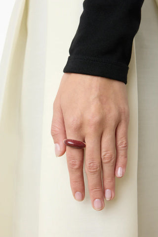 The Beatrice Ring in Sterling Silver with Red Mookiate from Lié Studio features a bold, sculptural dome design crafted from high-quality sterling silver and polished red mookiate stone. This elegant designer statement ring combines modern minimalism with organic textures, making it a sophisticated addition to any contemporary jewelry collection.