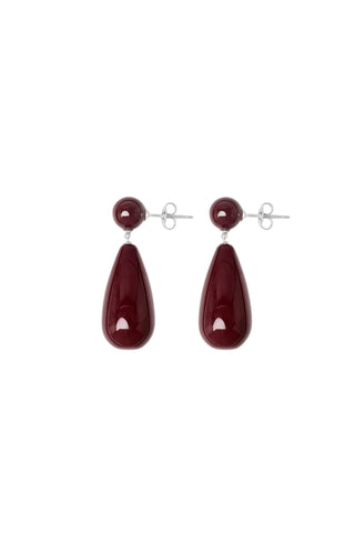 The Lola Earrings in Silver with Red Mookiate by Lié Studio feature a striking teardrop silhouette crafted from polished red mookiate stone and high-quality sterling silver. These elegant designer drop earrings blend a bold, sculptural aesthetic with timeless materials, offering a sophisticated statement piece for any jewelry collection.