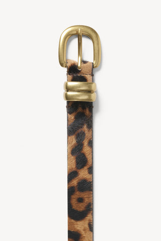 By Malene Birger Zoilo Leo Belt in Leopard, a premium calf hair waist belt featuring a striking animal print and a rounded gold-tone buckle. This bold statement accessory adds a luxurious texture and a modern focal point to neutral knitwear or classic denim outfits.