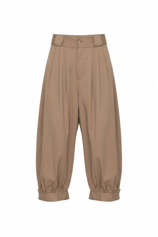 Sea New York Lois Twill Pants in Taupe are mid-waist and feature front pleats and wide belt loops. Balloon leg silhouette with snap button closure at ankles. 