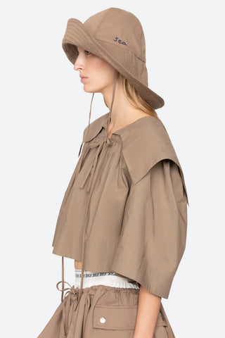 Sea New York Lois Twill Hat in Taupe is a neutral toned hat featuring six panel construction and adjustable tie chin strap. Versatile spring and summer accessory.