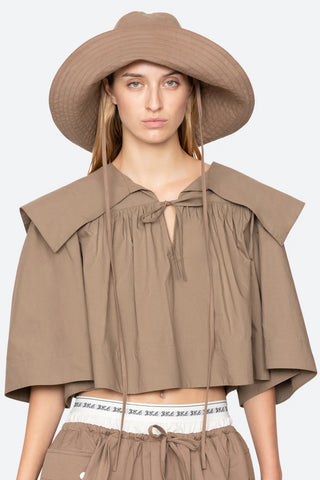 Sea New York Lois Twill Hat in Taupe is a neutral toned hat featuring six panel construction and adjustable tie chin strap. Versatile spring and summer accessory.