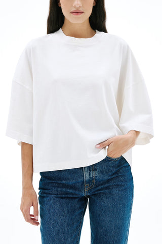 The SLVRLAKE Box Tee in Natural White features a relaxed, oversized silhouette with wide short sleeves and a classic crew neckline for a modern, minimalist aesthetic. This premium cotton cropped t-shirt offers a versatile staple for high-waisted denim styling and effortless everyday wear.