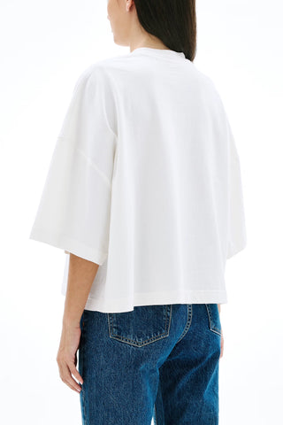 The SLVRLAKE Box Tee in Natural White features a relaxed, oversized silhouette with wide short sleeves and a classic crew neckline for a modern, minimalist aesthetic. This premium cotton cropped t-shirt offers a versatile staple for high-waisted denim styling and effortless everyday wear.