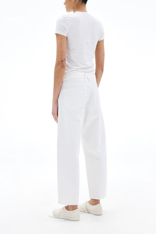 The SLVRLAKE Jamie Ankle Curve in White are mid-waist, designer jean featuring a unique curved leg silhouette and a cropped ankle length. Crafted from premium white denim, these stylish trousers offer a contemporary fit with a classic five-pocket construction for a clean, sophisticated look.