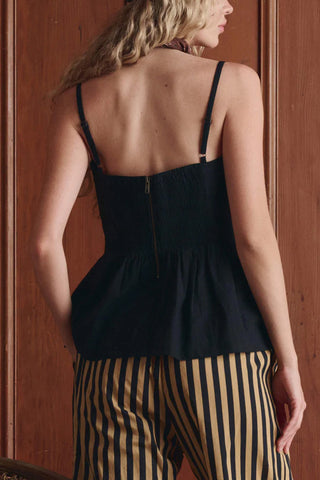 The Great Verse Top in Black, a feminine cotton blouse featuring a flattering sweetheart neckline, delicate adjustable straps, and a cinched bodice. This versatile black camisole top offers a sophisticated, romantic silhouette that pairs perfectly with high-waisted denim or the matching Verse skirt.